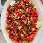 A bright, easy tomato salad recipe with step-by-step instructions, pros & cons, make-ahead tips, variations (Caprese, Mediterranean, Mexican), nutrition, and storage — perfect for summer produce.